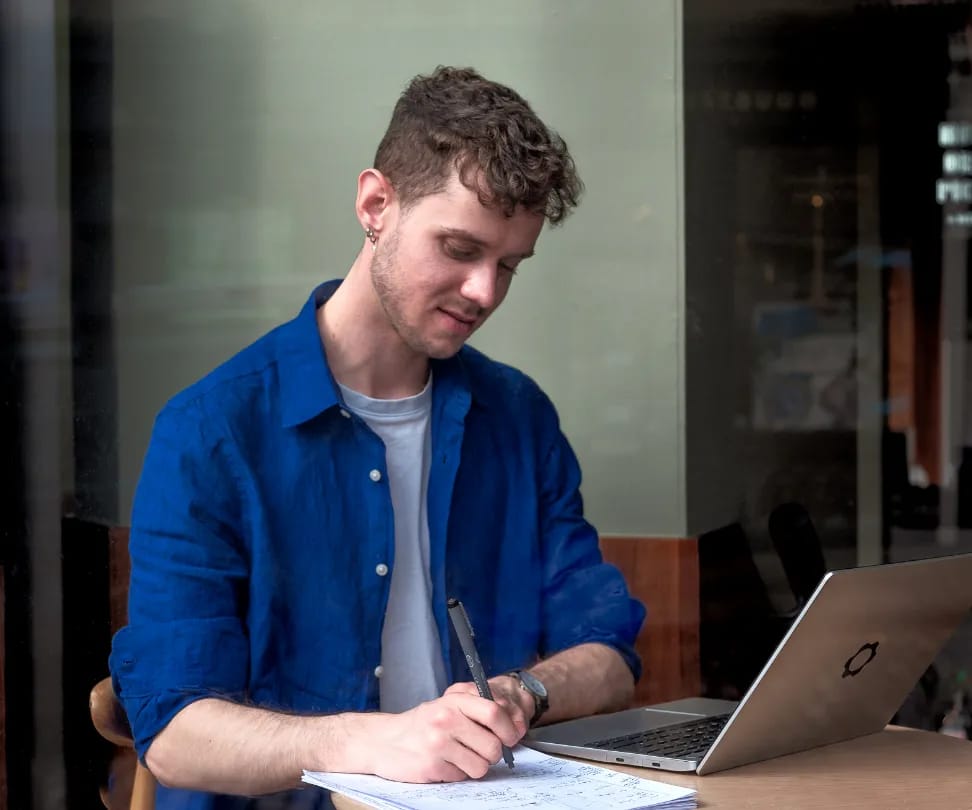 Chris working at his laptop